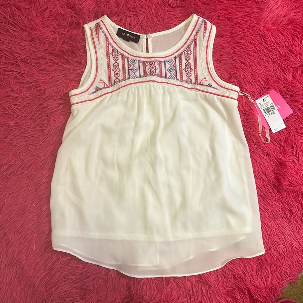 A girl’s Amy Byer shirt